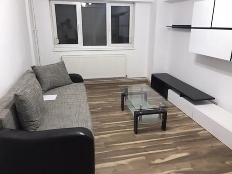 Iinchiriez apartament in  ultra central mobilat nou